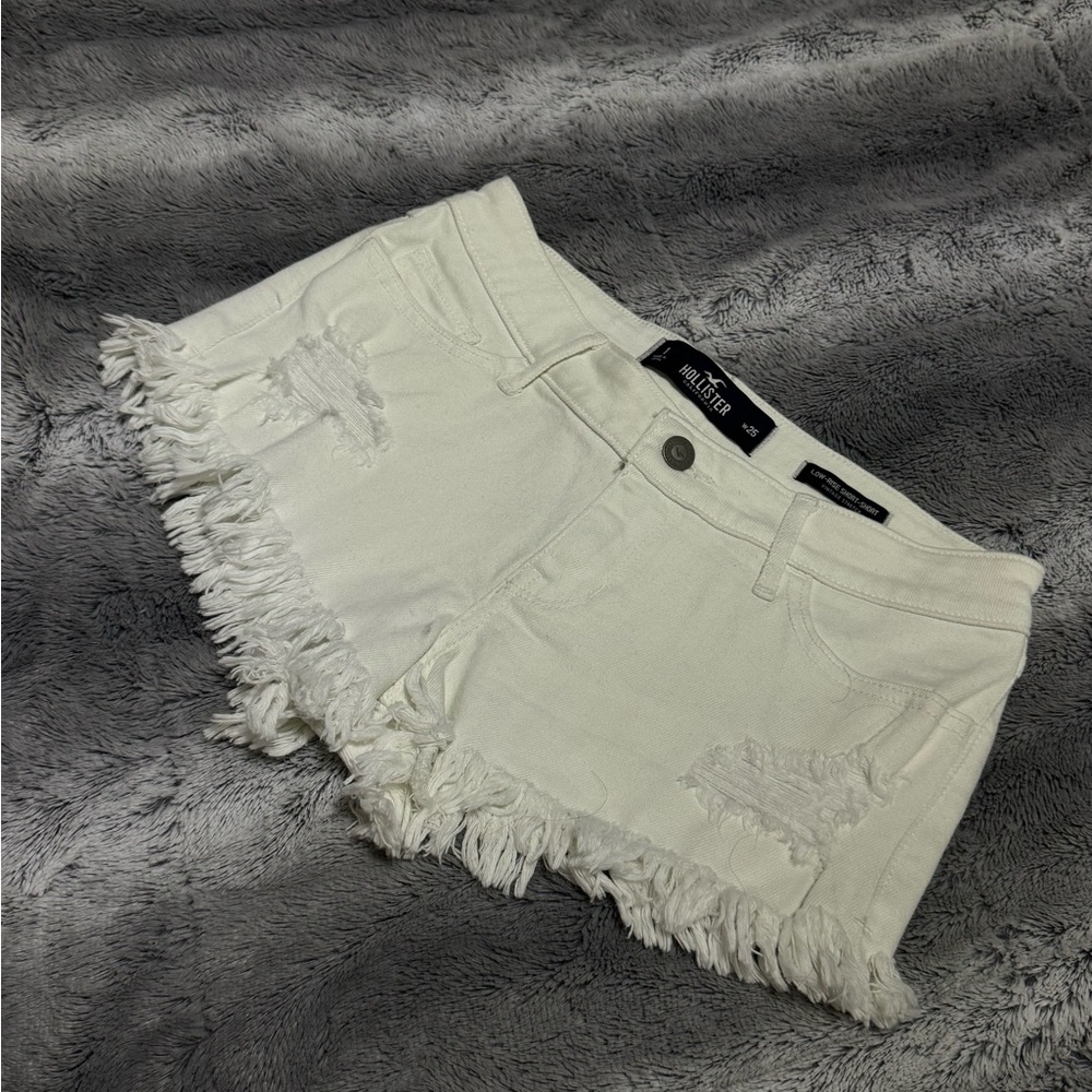 White denim Hollister shorts with fringe